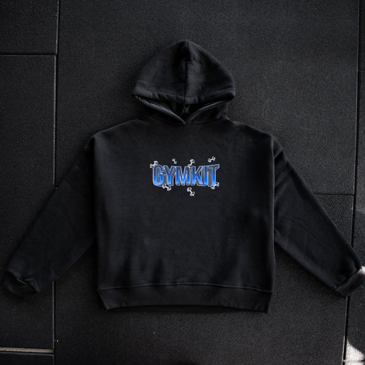 Black hoodie with 'GYMKIT' text on a dark tiled floor