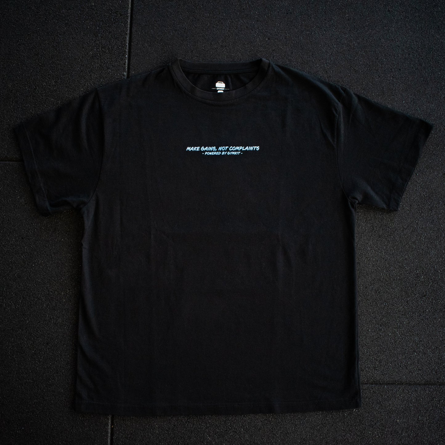 Black t-shirt with white text on a dark background