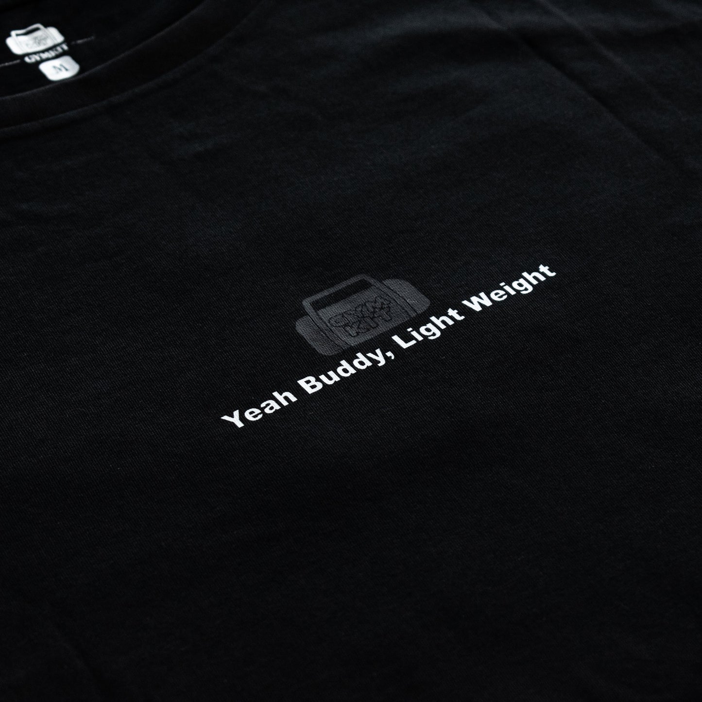 Black t-shirt with 'Yeah Buddy, Light Weight' text and logo on a dark background