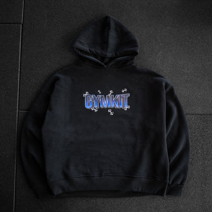 Black hoodie with 'GYMKIT' logo on a dark tiled floor