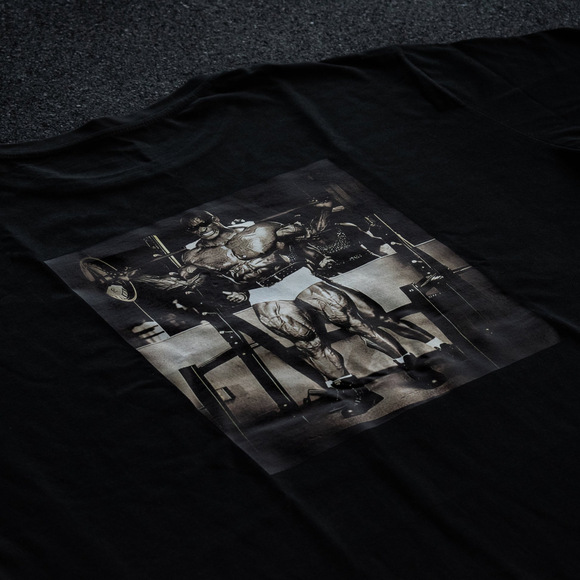 Black t-shirt with a graphic design of a horse and rider on a dark background