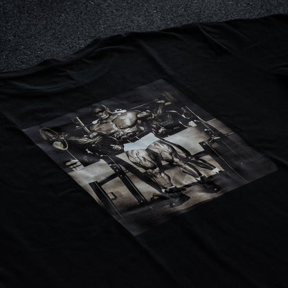 Black t-shirt with a graphic design of a horse and rider on a dark background