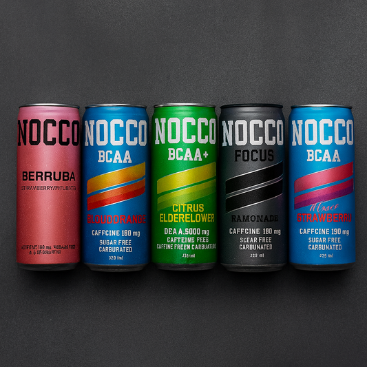Five NOCCO supplement cans in various flavors on a dark background