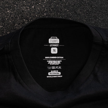 Black t-shirt with white branding and text on a textured black background